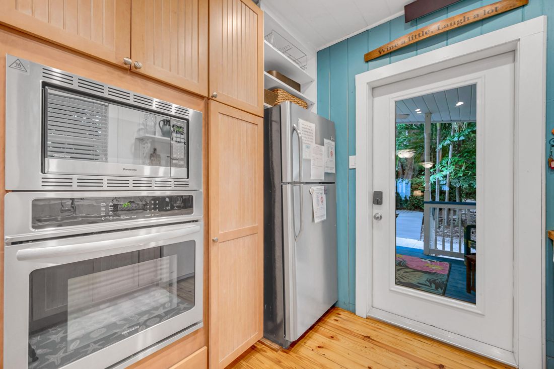 Kitchen, oven, and refrigerator at Butterfly House Islamorada