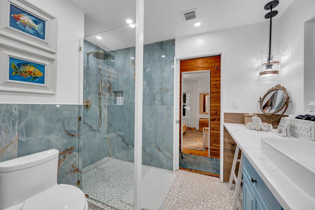 Master bathroom with stone tile and shower