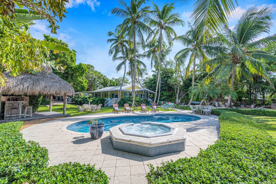 Front yard, pool, and tiki bar at Butterfly House Islamorada