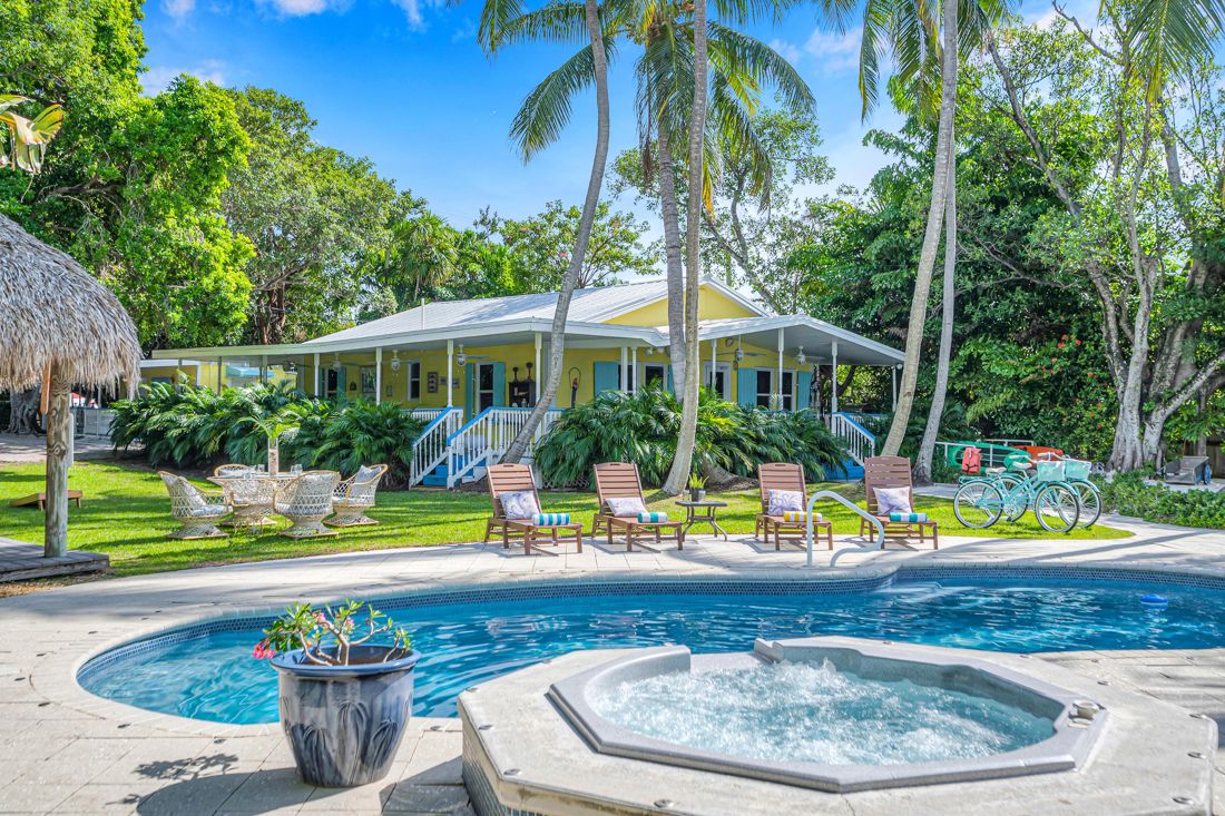 Pool, tiki bar, and main house at Butterfly House Islamorada