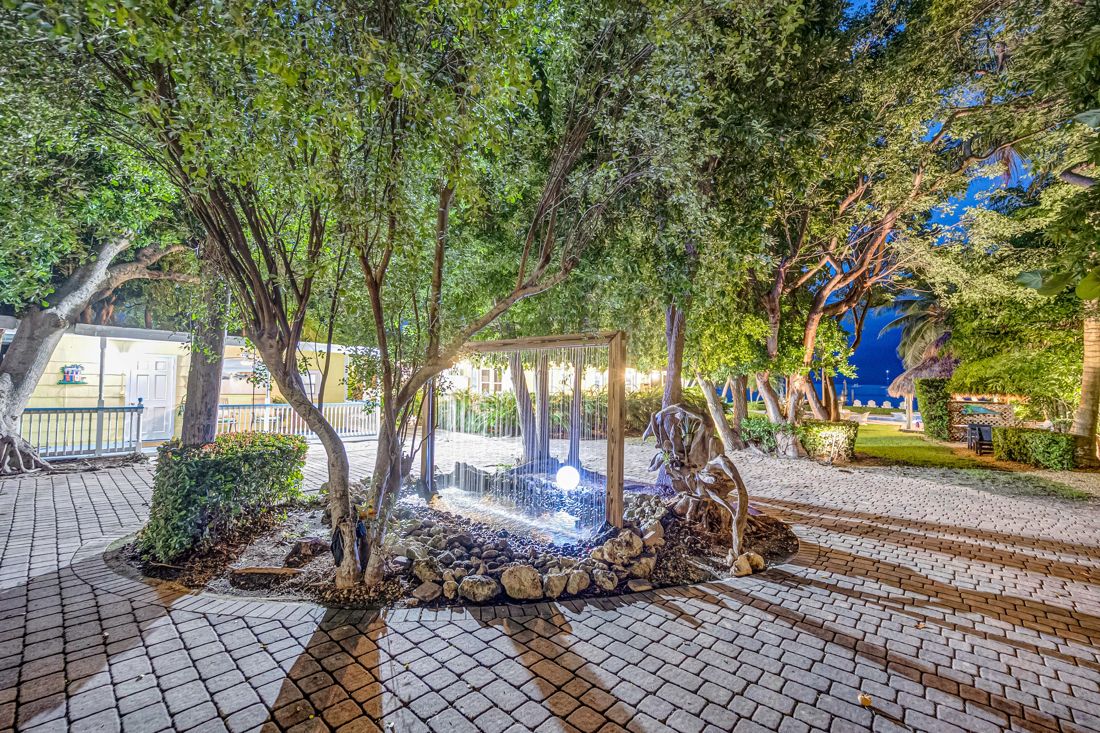 Twilight driveway with fountain at Butterfly House Islamorada